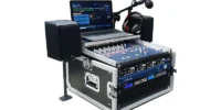 AEV Outside Flightcase portable radio studio with BSM Evolution console, rack electronics, laptop with automation software, microphones, headphones and compact active monitors in a rugged flightcase.